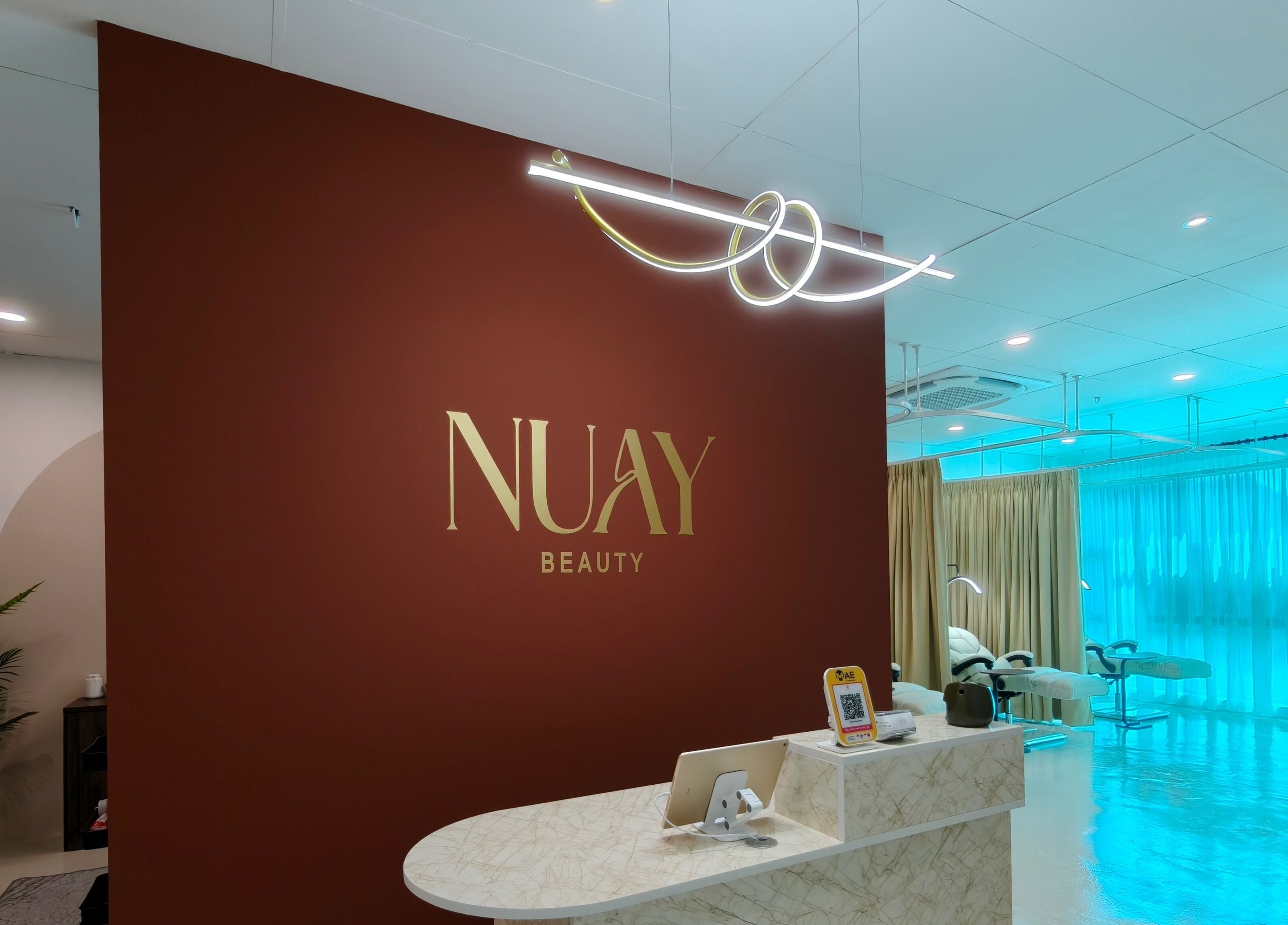 Nuay Beauty reception area in Shah Alam, Selangor, MY featuring modern decor and elegant lighting.
