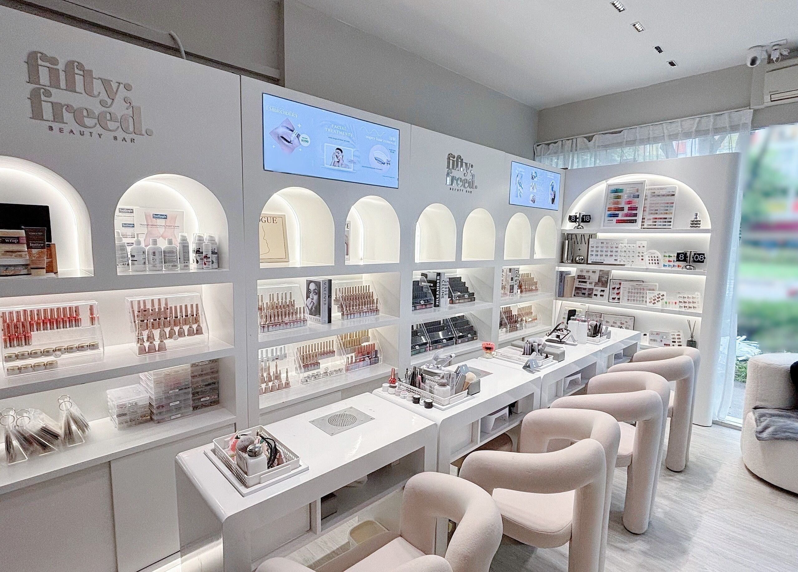 Elegant interior of @fiftyfreed.sg - Aljunied, Singapore, SG, showcasing modern beauty products and seating area.