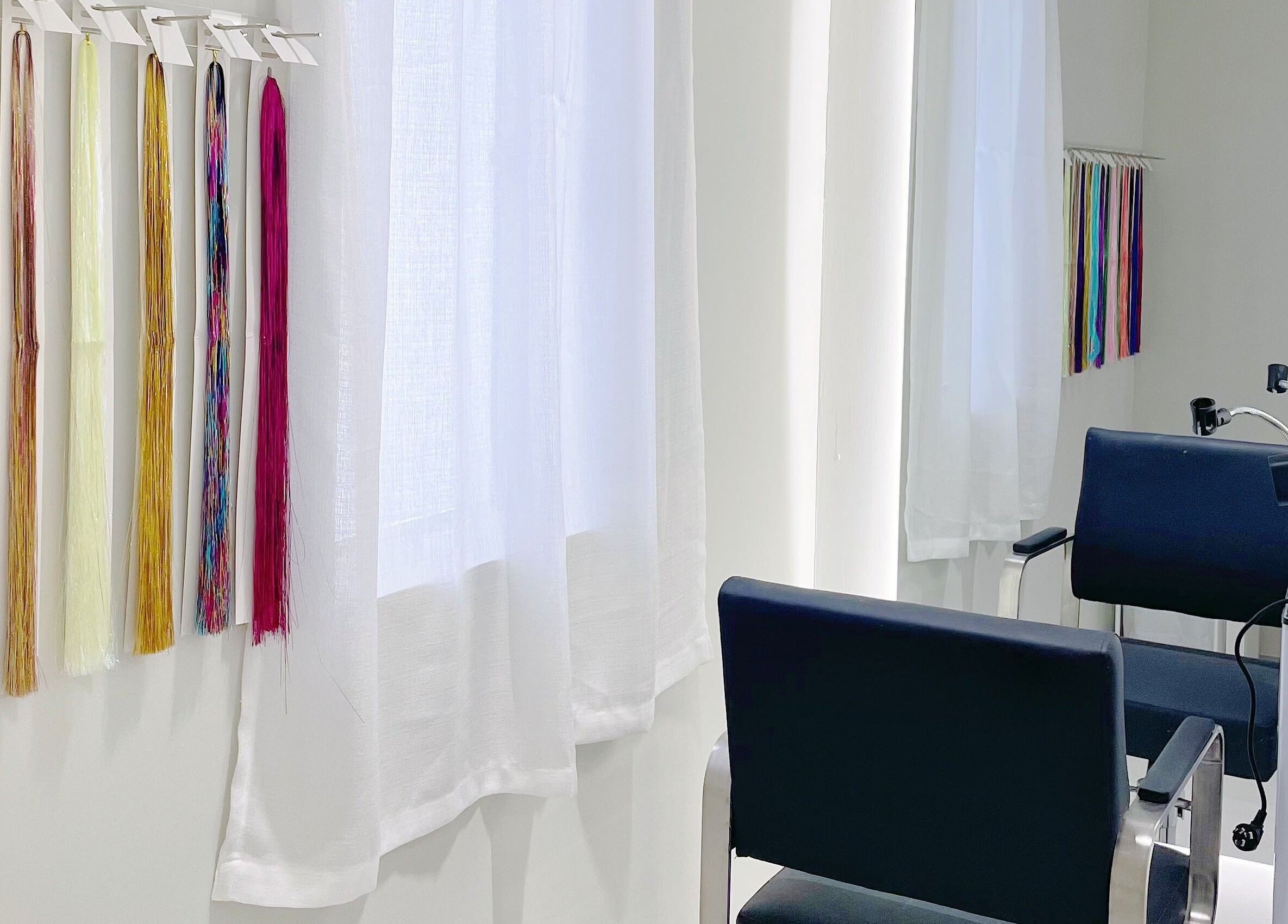 Chic salon space at @fiftyfreed.sg - Choa Chu Kang. Color samples and chairs enhance this Singapore, SG venue.