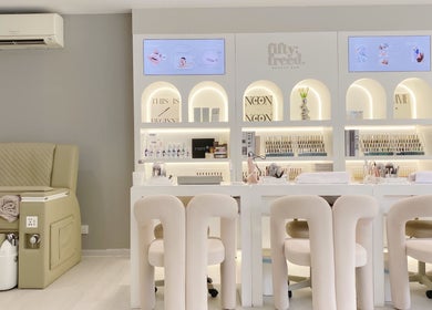 Elegant interior of Fiftyfreed Beauty Bar - Kovan, Singapore, Singapore, SG with plush chairs and modern design.