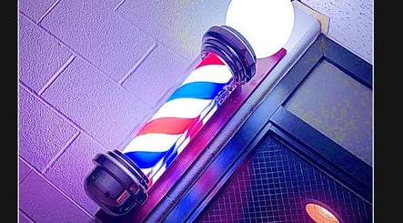 Radiant barber pole outside Westside Beauty & Barbershop, Dunkirk, Indiana, US, symbolizing classic grooming elegance.