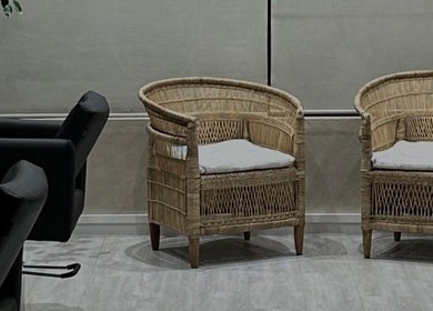 Stylish rattan chairs in the welcoming area of BLONDKOP, Cape Town, Western Cape, ZA.