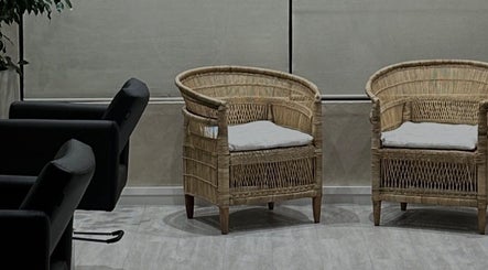Stylish rattan chairs in the welcoming area of BLONDKOP, Cape Town, Western Cape, ZA.