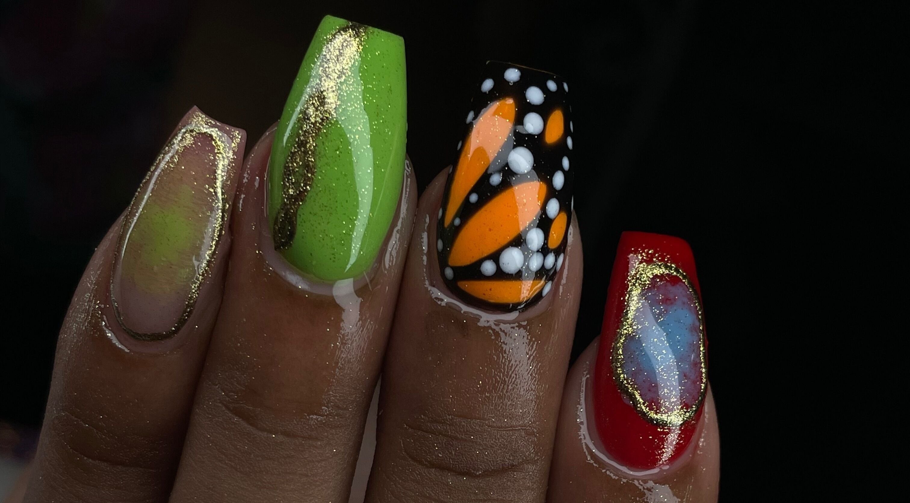 Vibrant nail art at Tiff’s Creations, Bridgetown, Saint Michael, BB. Features green, orange, and red designs.