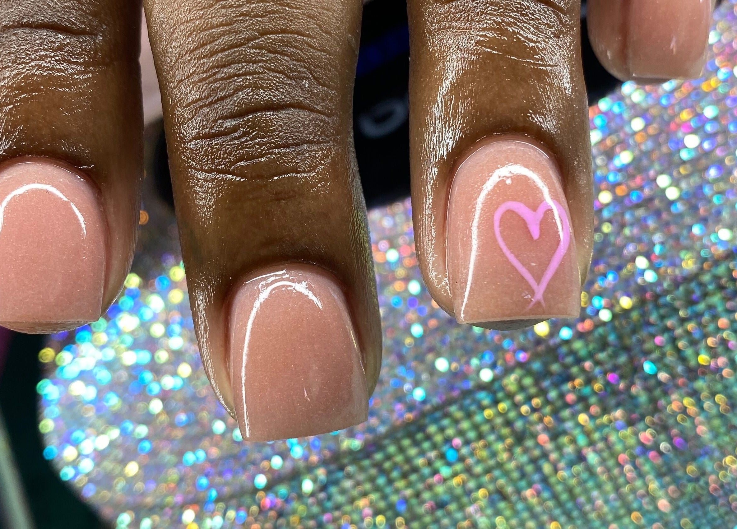 Elegant pink manicure with heart design at Tiff’s Creations, Bridgetown, Saint Michael, BB.