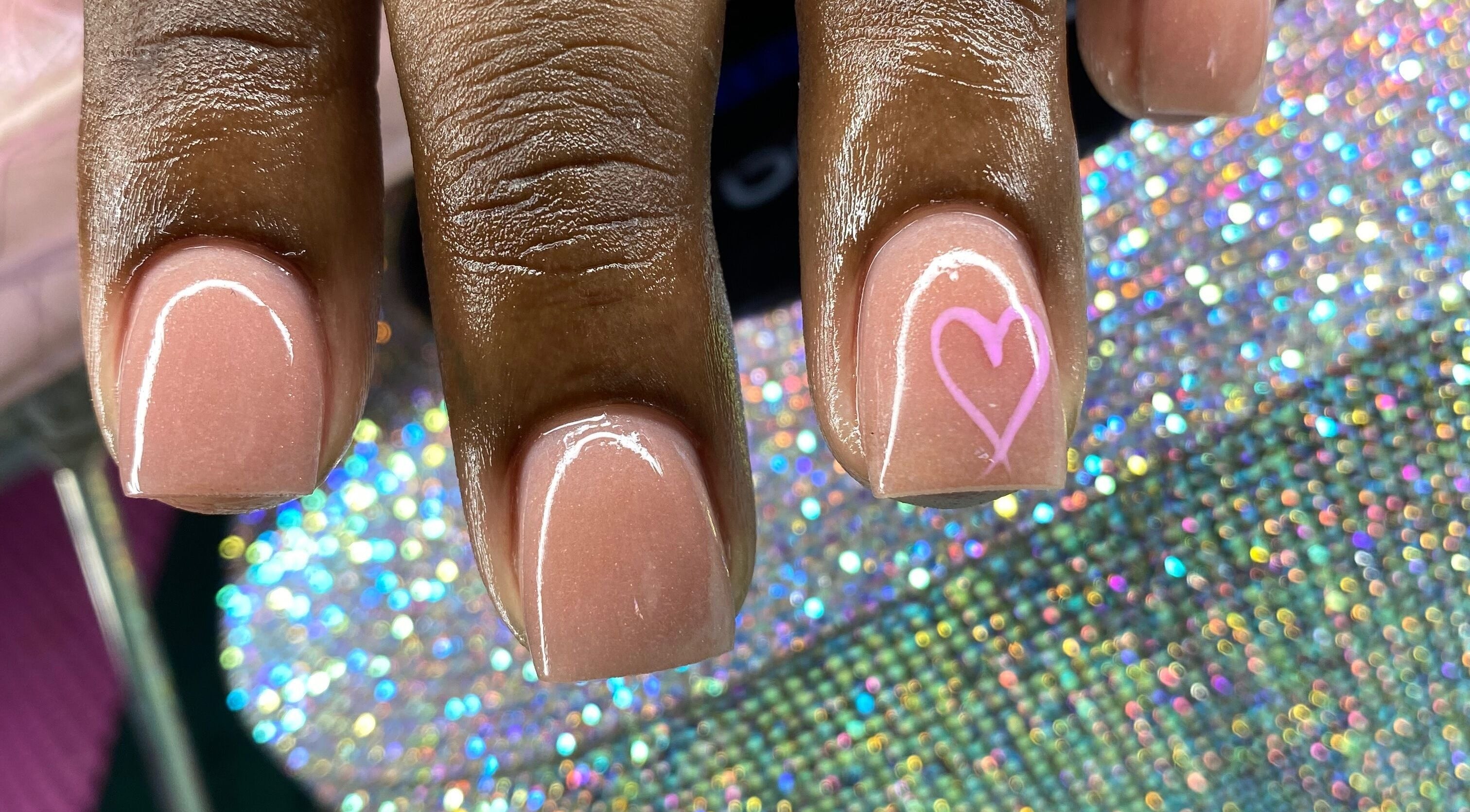 Elegant pink manicure with heart design at Tiff’s Creations, Bridgetown, Saint Michael, BB.