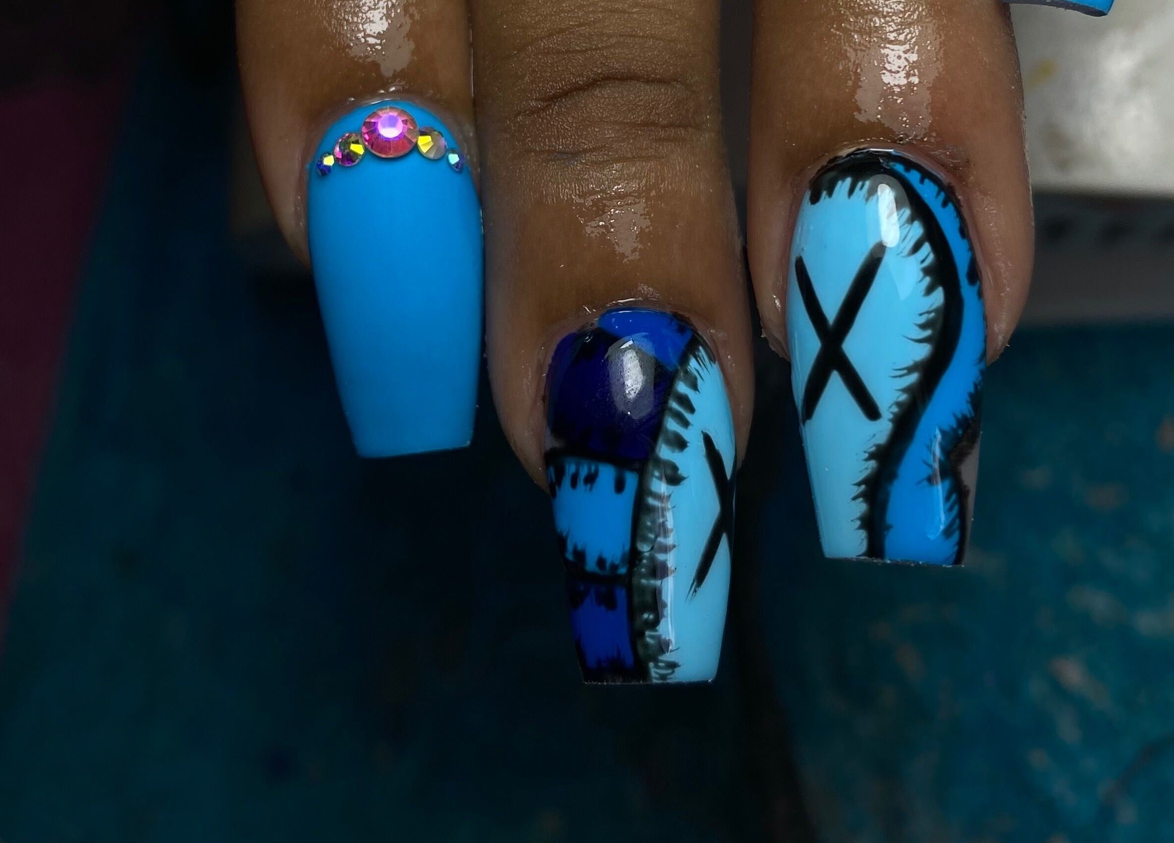 Creative blue nail designs with rhinestones by Tiff’s Creations in Bridgetown, Saint Michael, BB.