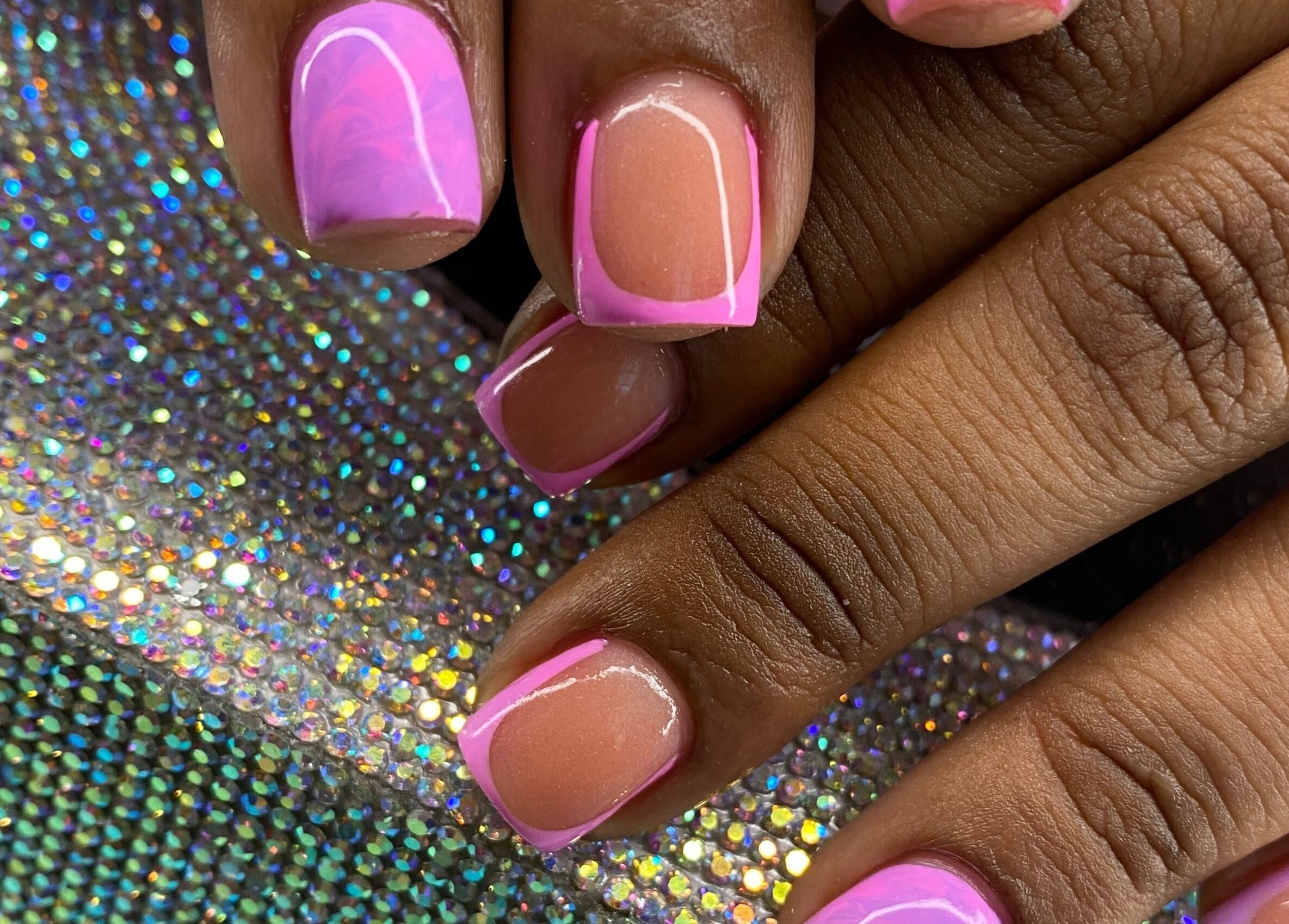 Pink nail art on elegant nails at Tiff’s Creations, Bridgetown, Saint Michael, BB on a sparkling surface.