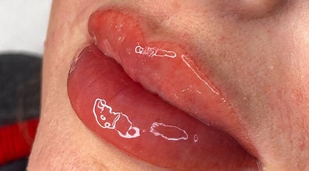 Close-up of glossy lips showcasing expert beauty treatment at Poise Studio, Ramsbottom, England, GB.
