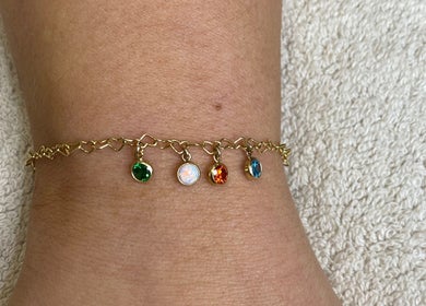 Colorful charm bracelet displayed at Poise Studio, located in Ramsbottom, England, GB.