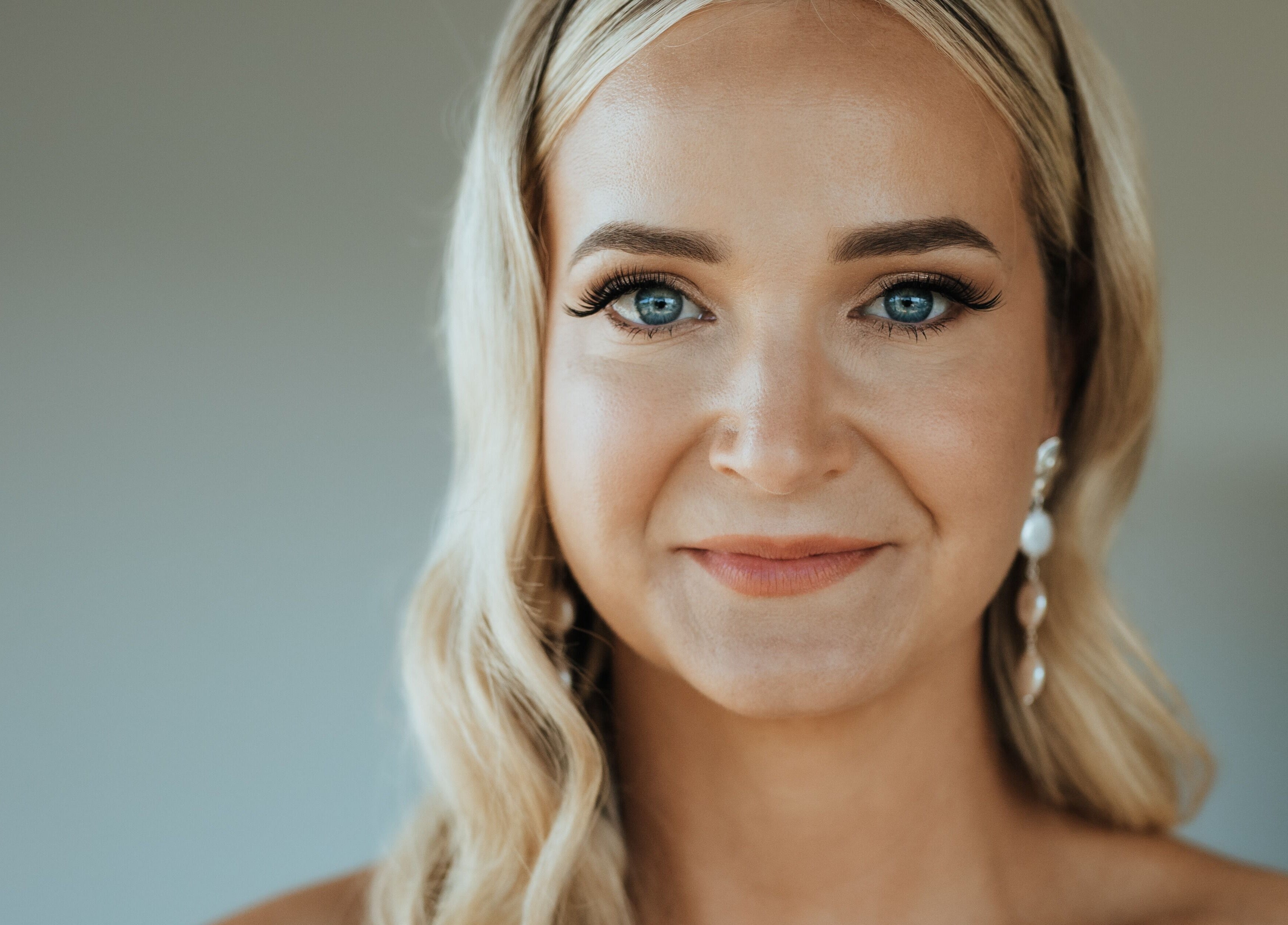 Smiling woman showcasing bridal makeup at Makeup by SJ, Joondalup, Western Australia, AU.