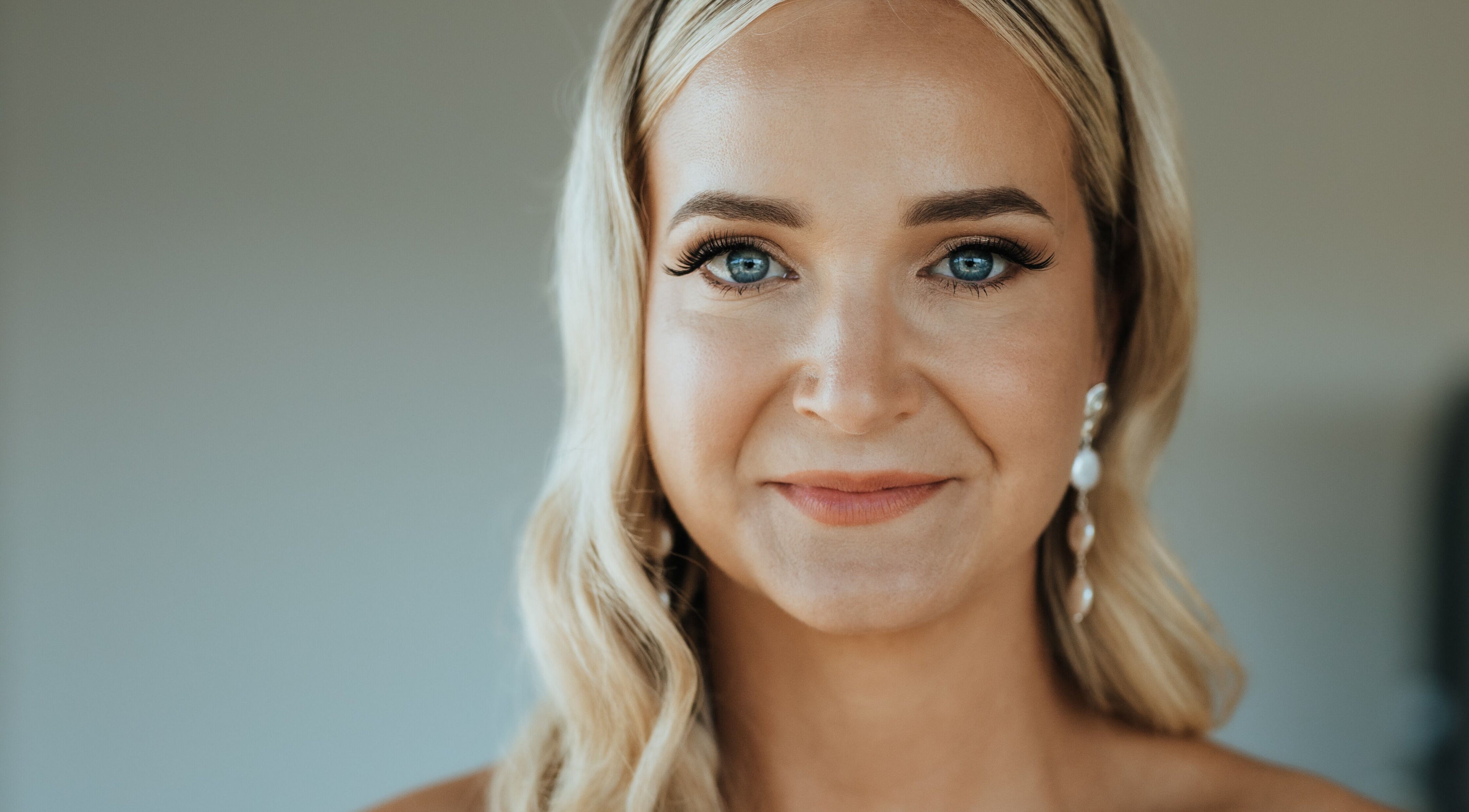 Smiling woman showcasing bridal makeup at Makeup by SJ, Joondalup, Western Australia, AU.
