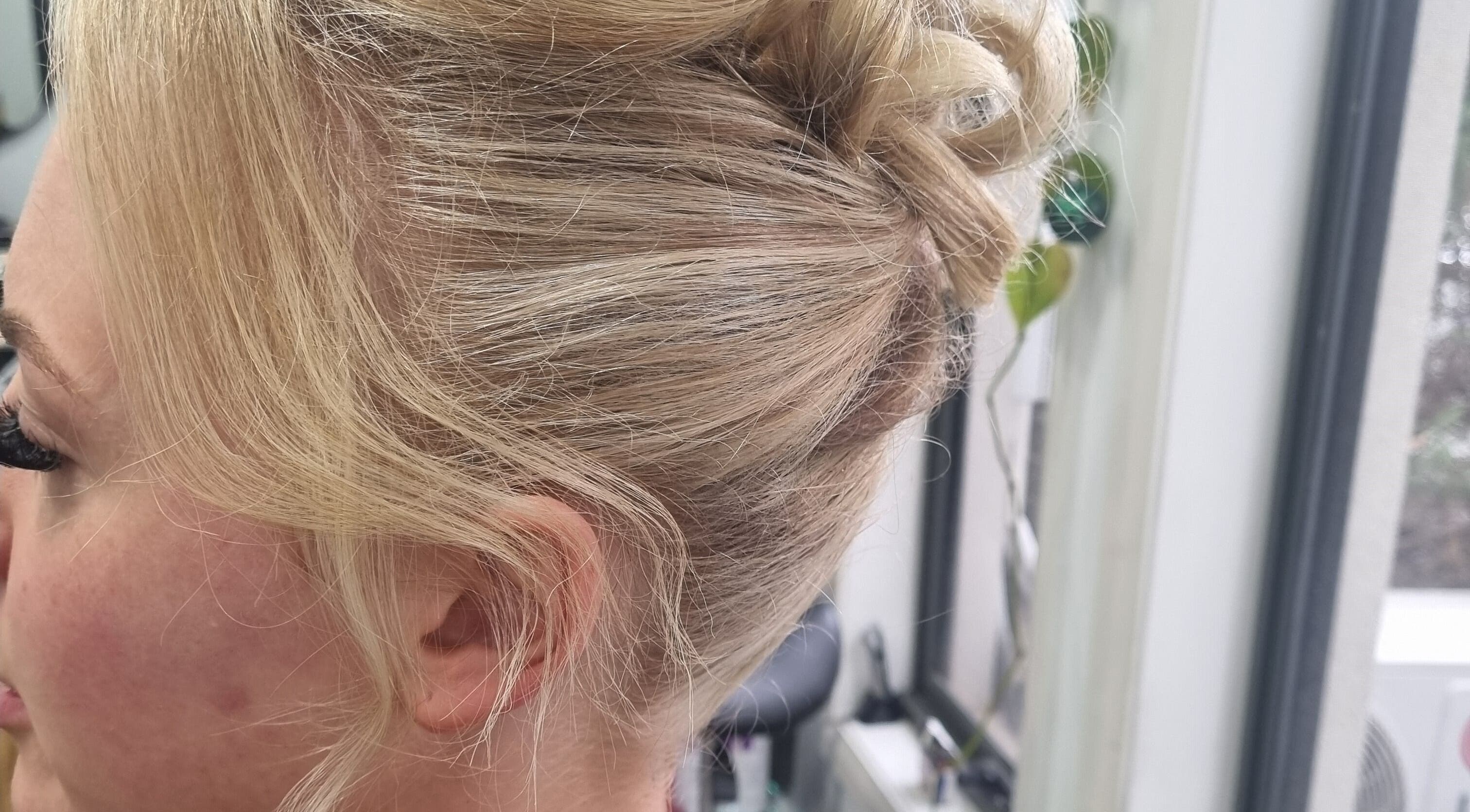 Elegant blonde updo hairstyle at Connie & Co Hairdressing, Melbourne, Victoria, AU.