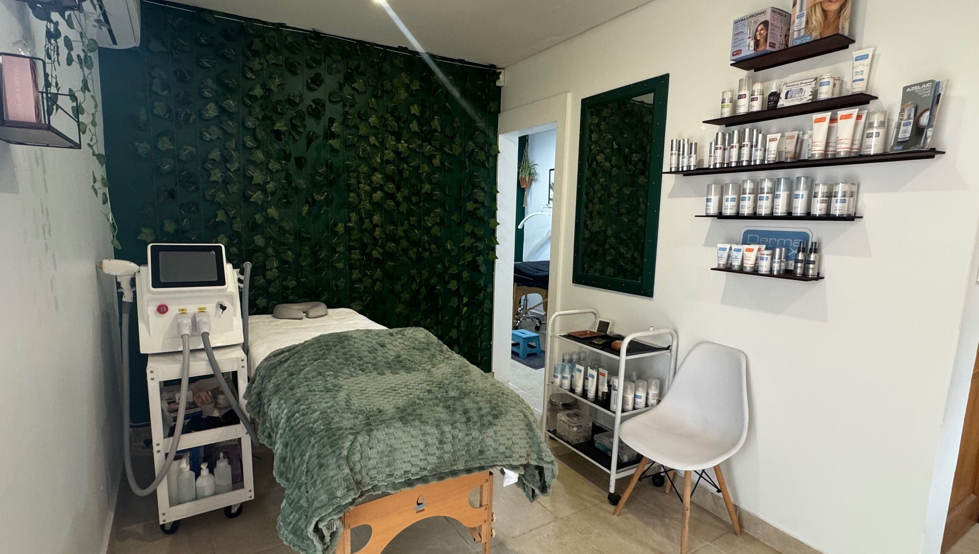 Treatment room at Studio 48, Randburg, Gauteng, ZA with spa bed and greenery décor.