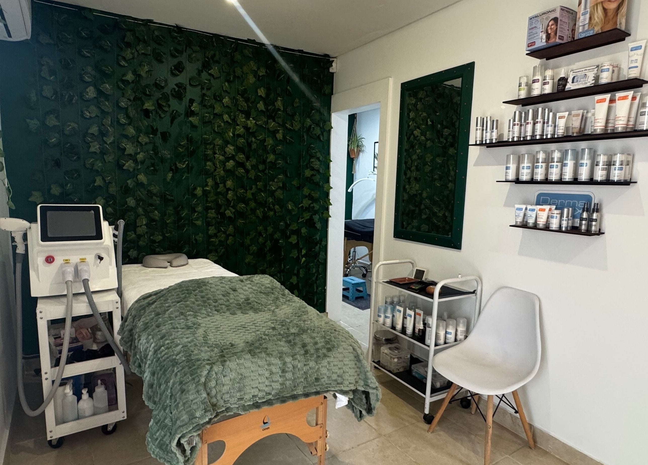 Treatment room at Studio 48, Randburg, Gauteng, ZA with spa bed and greenery décor.