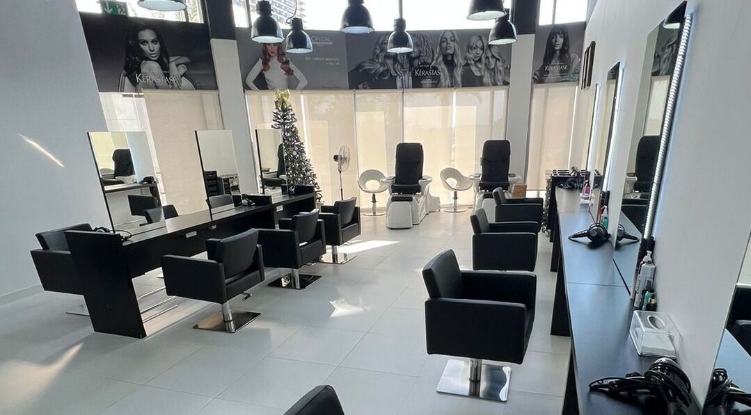 Modern salon interior at Rami Makeover Hair and Beauty Salon in DIFC, Dubai, AE, featuring sleek styling stations.