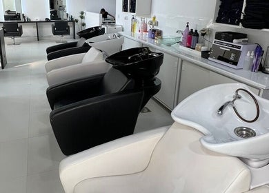 Elegant wash stations at Rami Makeover Hair and Beauty Salon, DIFC, Dubai, AE, ready for a luxurious experience.