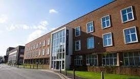 Exterior of Waxing by Amy in Pontypool, Wales, GB, showcasing a modern brick building.