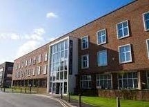 Exterior of Waxing by Amy in Pontypool, Wales, GB, showcasing a modern brick building.