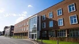 Exterior of Waxing by Amy in Pontypool, Wales, GB, showcasing a modern brick building.