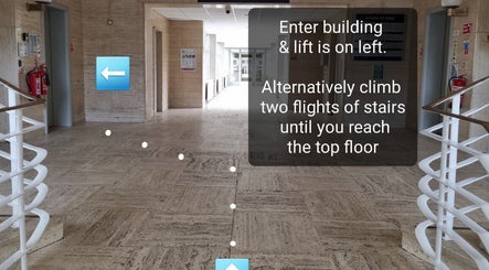 Entrance to Waxing by Amy with lift access in Pontypool, Wales, GB. Stairs and elevator visible.