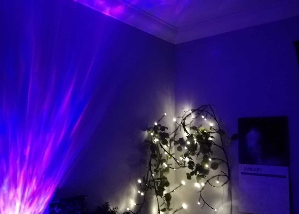 Purple ambiance with glowing lights at Violet Moon, Westcroft, England, GB, creating a tranquil wellness space.