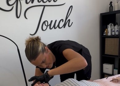 Lash artist at Lashes by x AA in Alton, England, GB perfecting a client's lashes with precision.