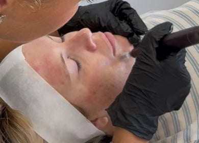 Facial treatment at Lashes by x AA in Alton, England, GB. A professional applying skincare with precision.