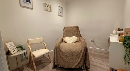 Tranquil beauty room at Brow Honey, Darlington, England, GB, featuring a plush chair and calming decor.
