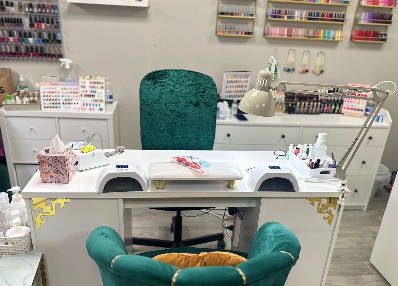 Nail salon setup at D Nail, Dublin 22, County Dublin, IE, featuring a manicure station and polishes.