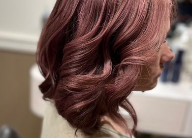 Elegant wavy hairstyle in rose gold at The PVD Hair Edit, Providence, Rhode Island, US.