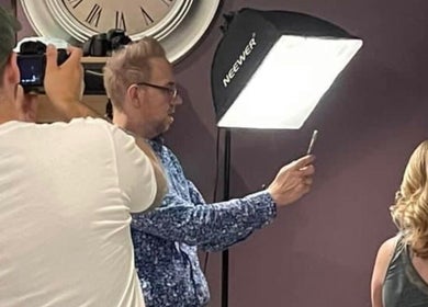 Stylist at The PVD Hair Edit in Providence, Rhode Island, US capturing a client's hair with professional lighting.