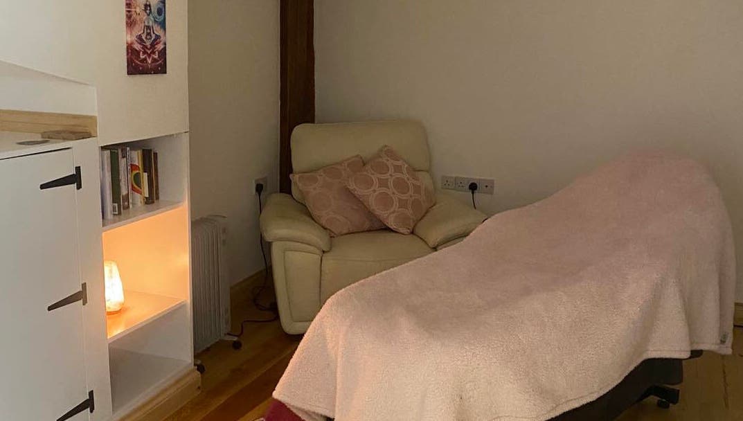 Cozy massage room at Soul2Sole by Emma White in Egmanton, England, GB, featuring a plush chair and soft lighting.