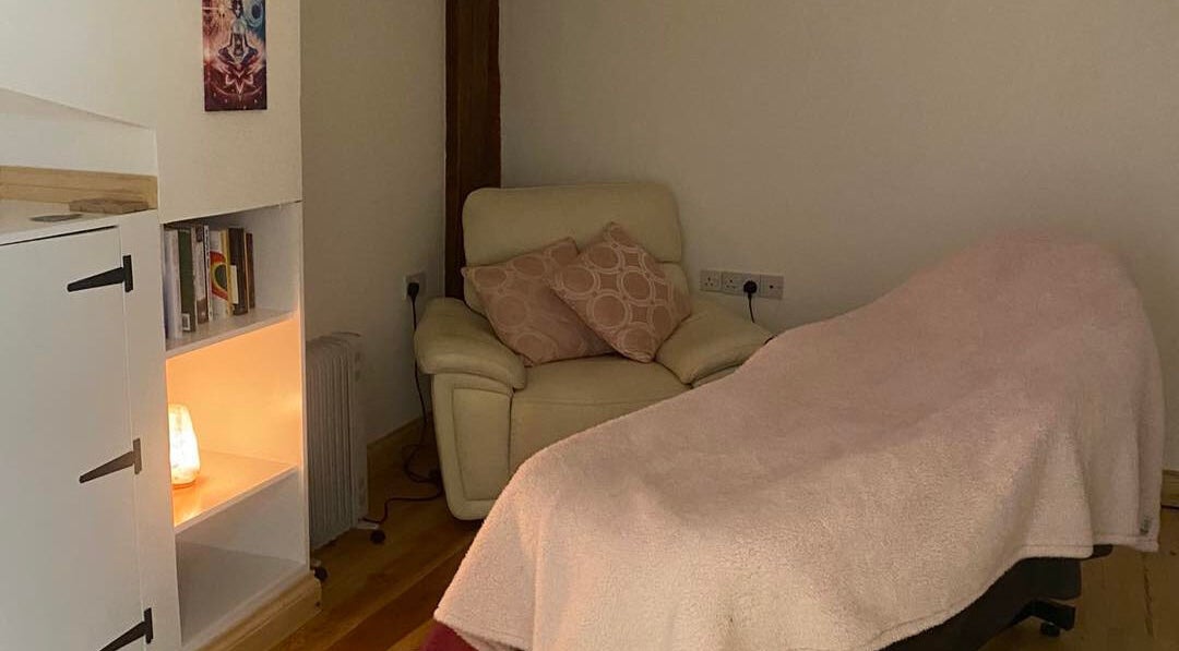 Cozy massage room at Soul2Sole by Emma White in Egmanton, England, GB, featuring a plush chair and soft lighting.