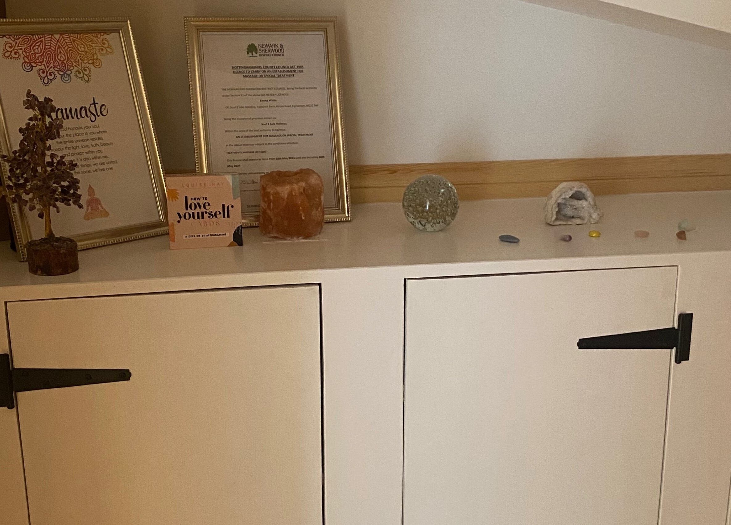 Decorative zen items on a shelf at Soul2Sole by Emma White in Egmanton, England, GB.