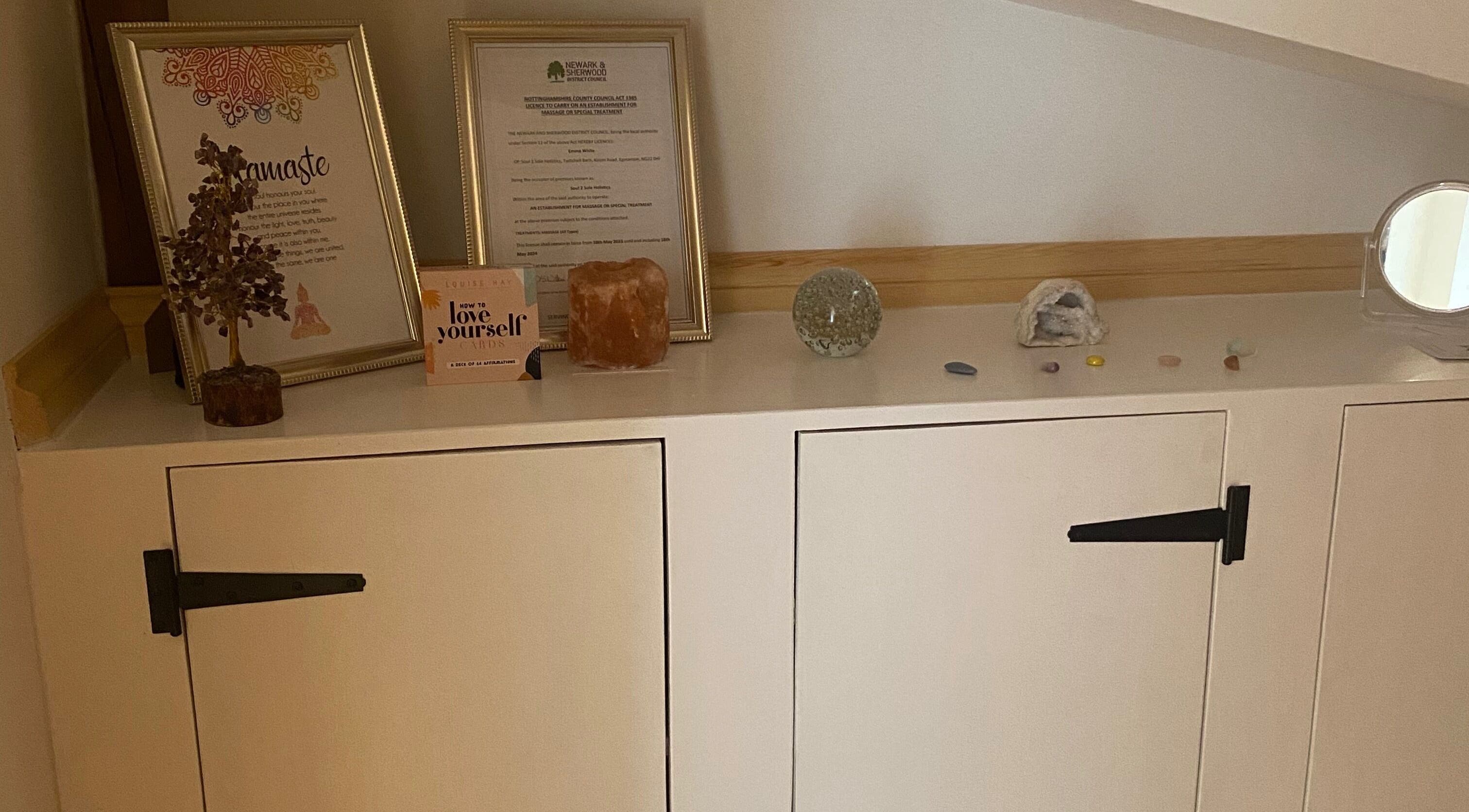 Decorative zen items on a shelf at Soul2Sole by Emma White in Egmanton, England, GB.