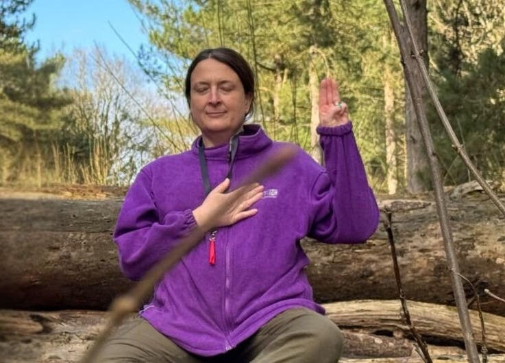 A person meditating in a forest at Soul2Sole by Emma White, Egmanton, England, GB.