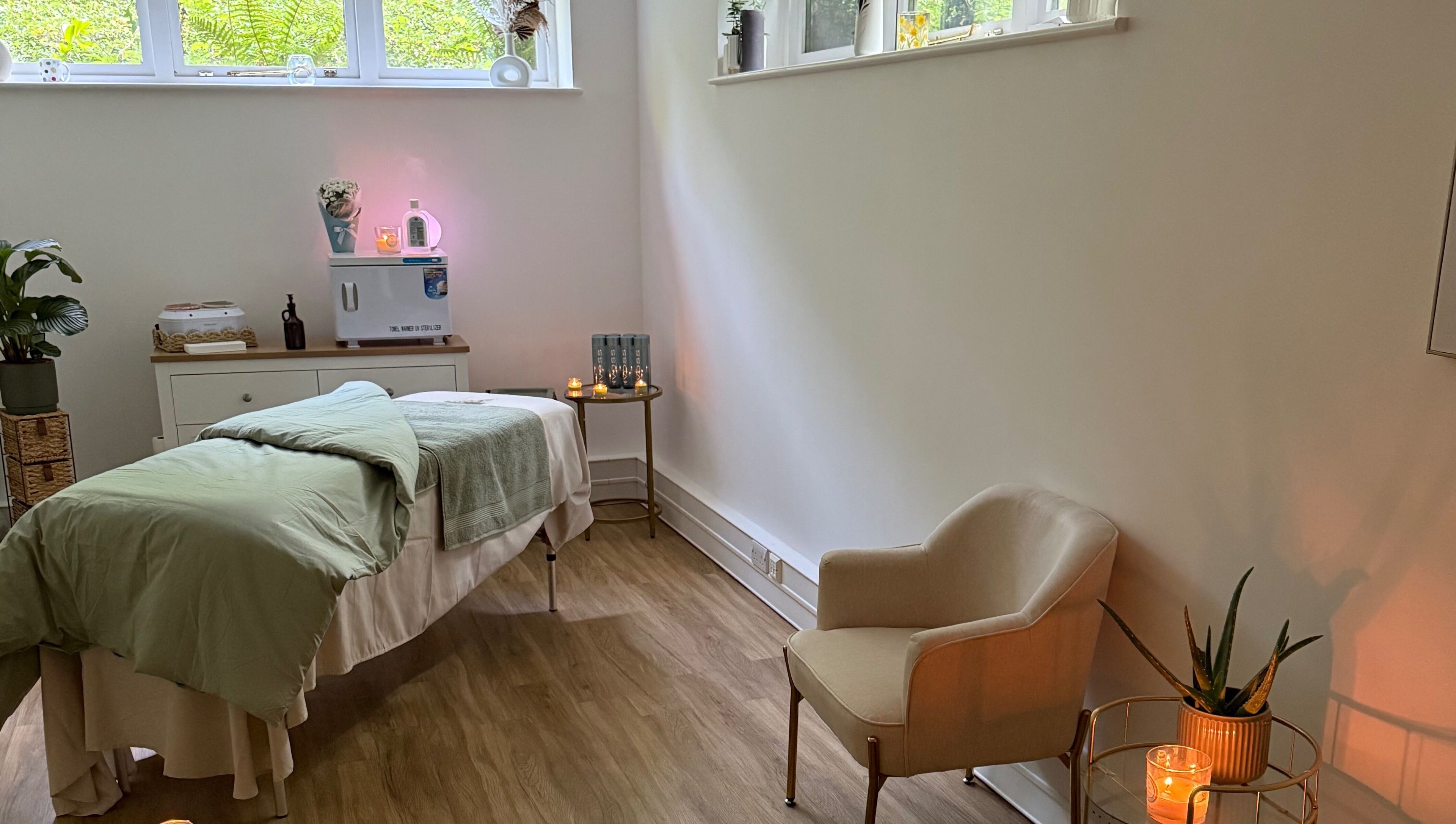 Calming spa room at Beauty by Elliemai, Rowlands Castle, England, GB with treatment bed and decor.