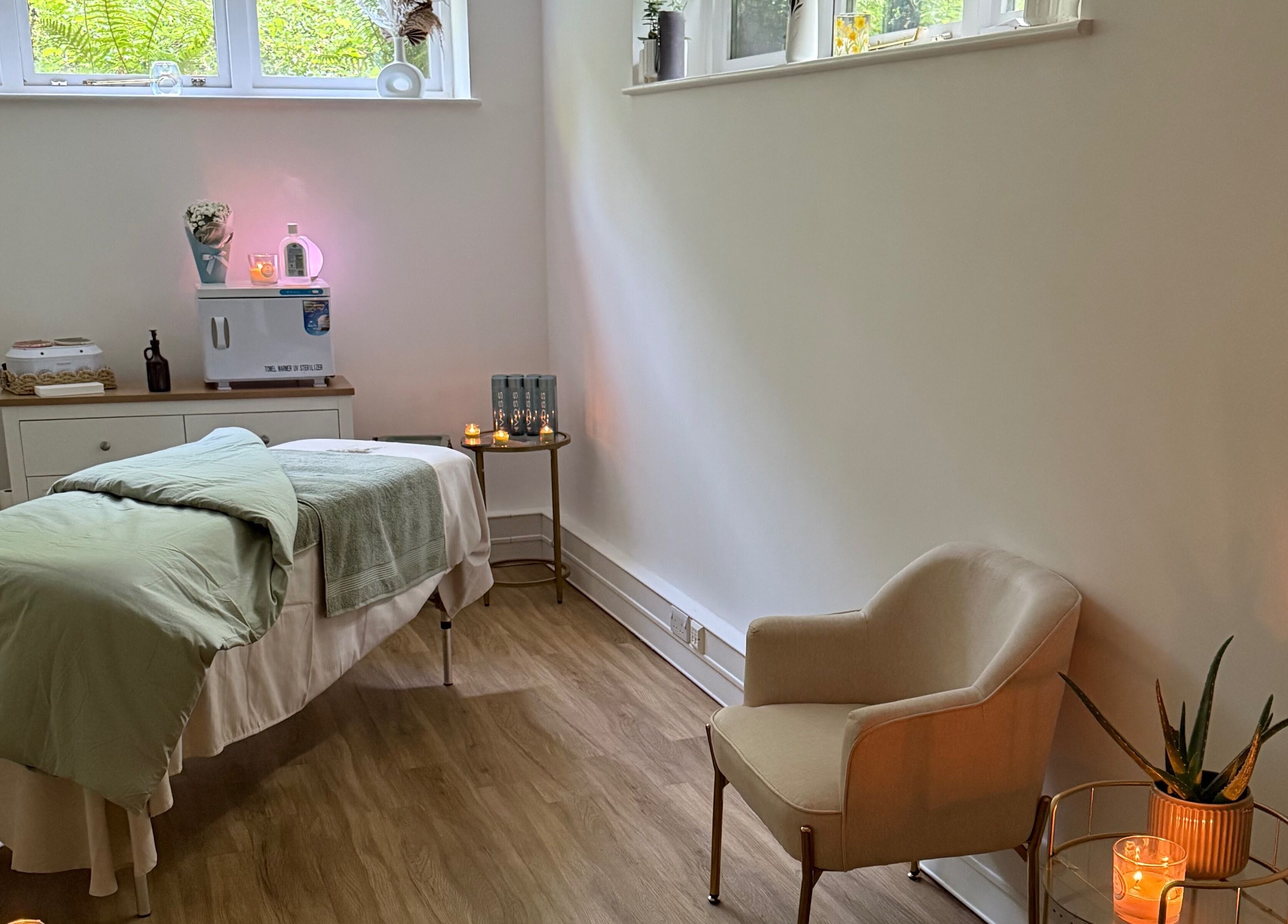Calming spa room at Beauty by Elliemai, Rowlands Castle, England, GB with treatment bed and decor.