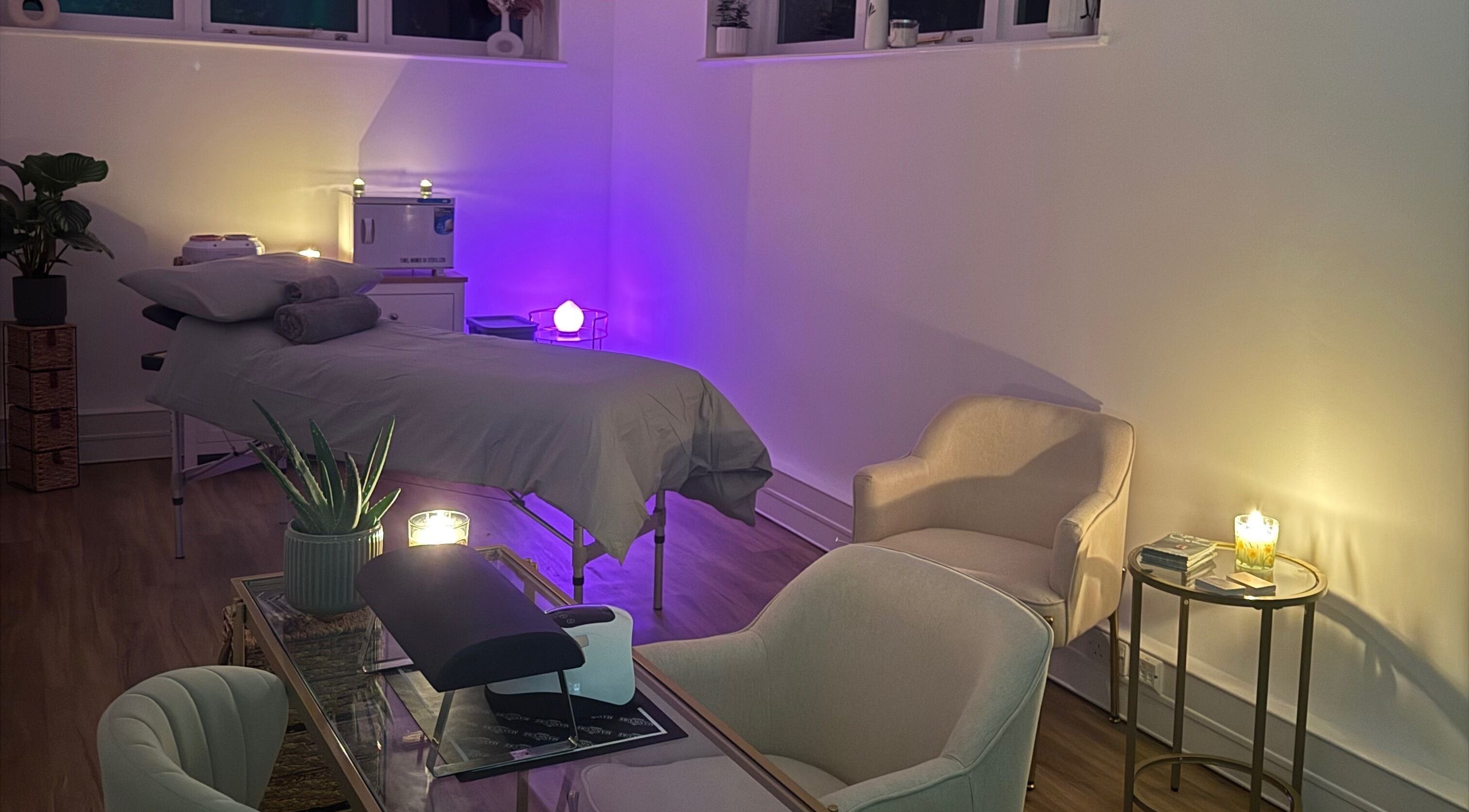 Relaxing treatment room at Beauty by Elliemai, Rowlands Castle, England, GB with ambient lighting and cozy seating.
