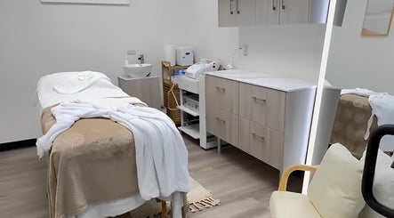 Tranquil treatment room at OYA Wellness - Brickell, Miami, Florida, US with cozy massage table and elegant decor.