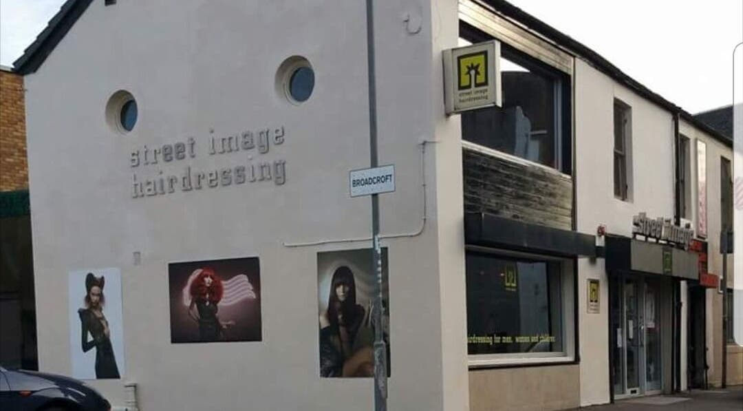 Street Image Hairdressing front view in Kirkintilloch, Scotland, GB showcasing its stylish modern facade.