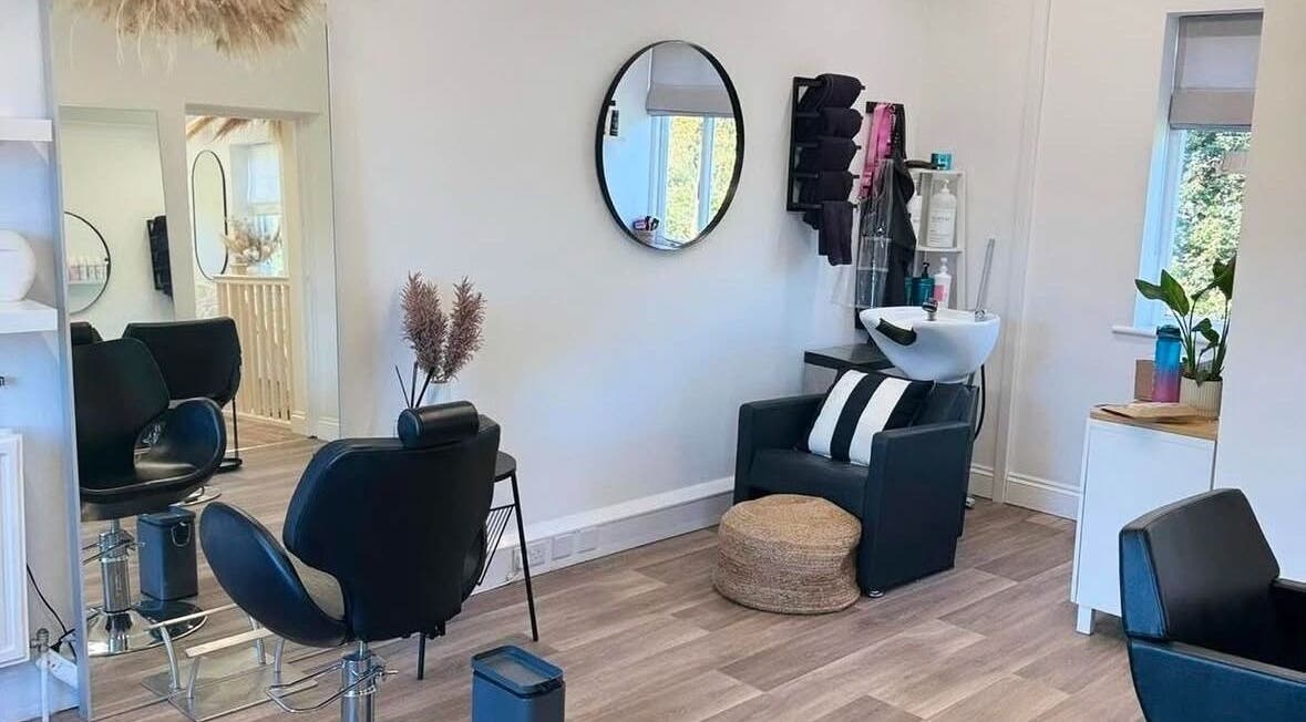 Locks Hair Extensions salon interior in St Austell, England, GB features stylish seating and modern decor.