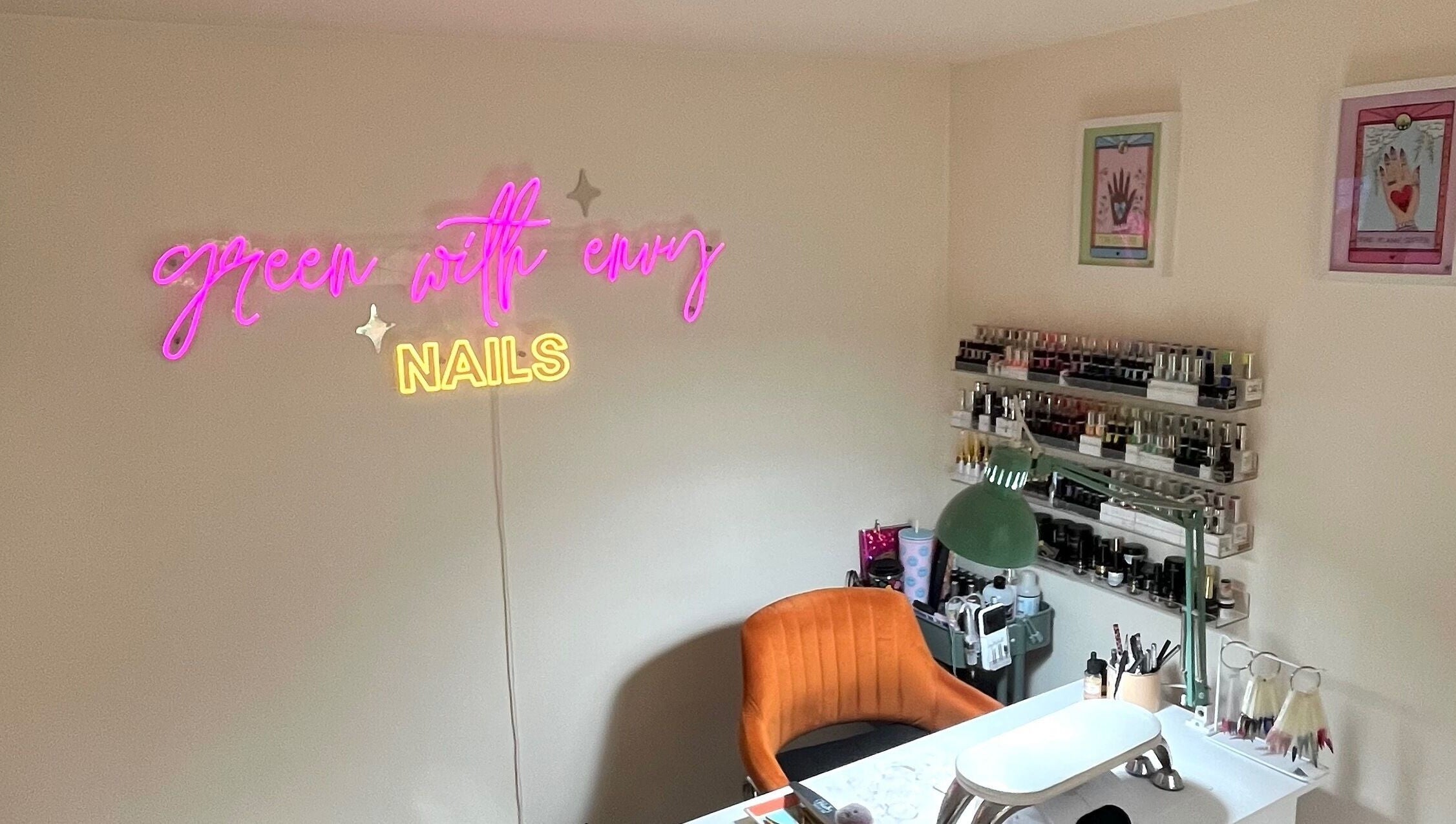 Inviting nail studio at Green with Envy Nails, Sutton, South London, with neon sign and elegant decor.