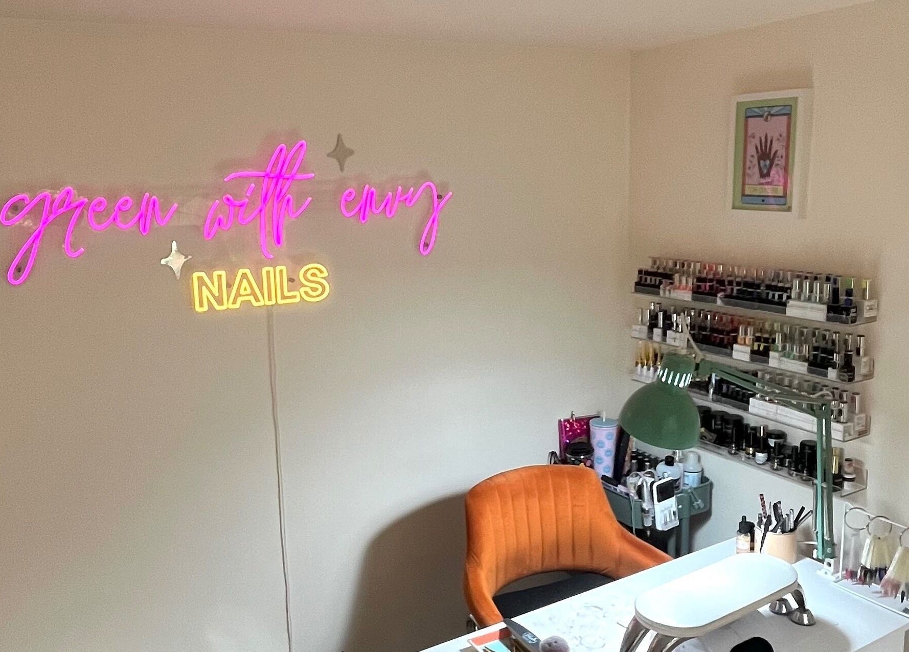Inviting nail studio at Green with Envy Nails, Sutton, South London, with neon sign and elegant decor.