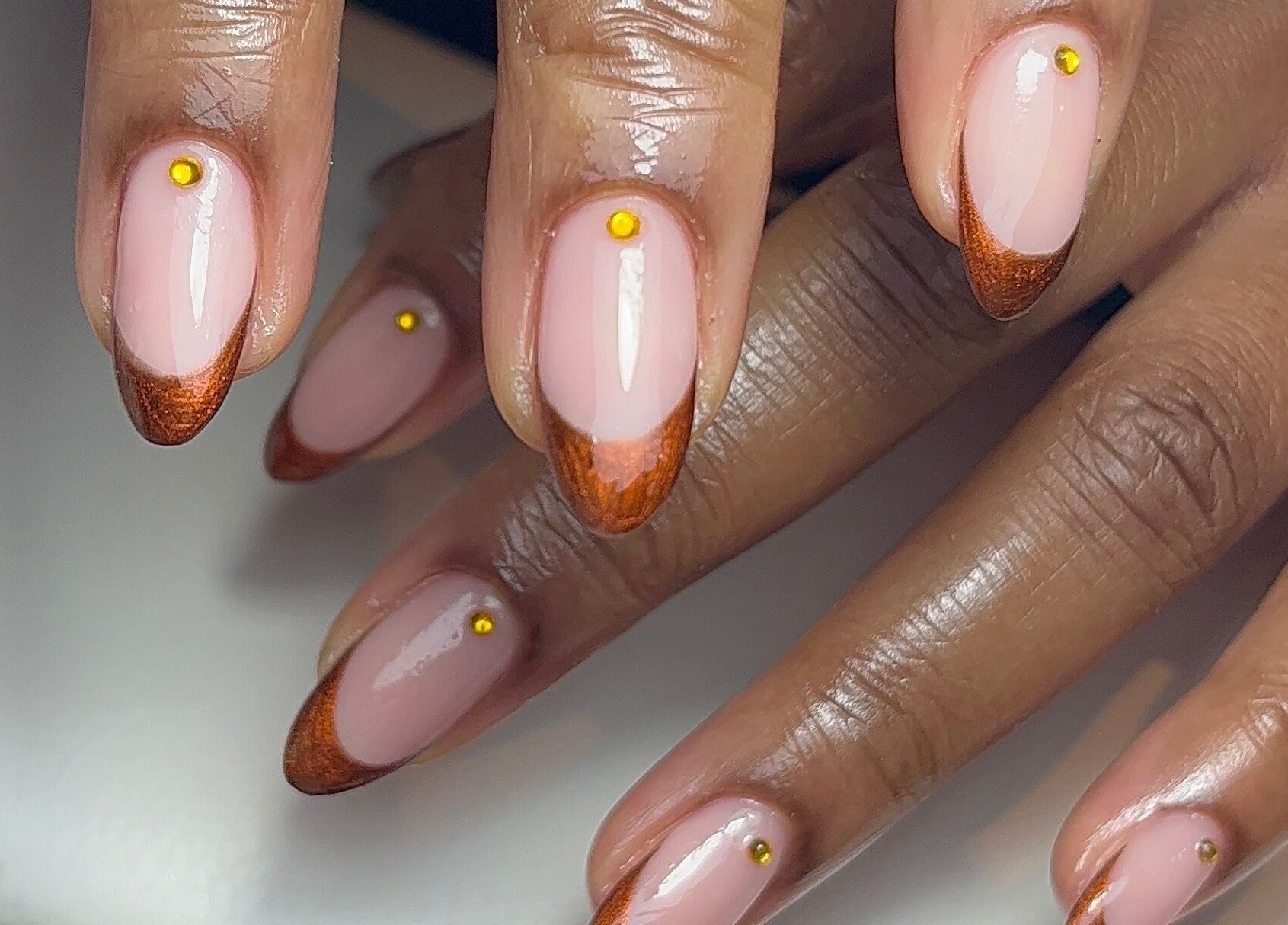 Stunning bronze-tipped nails at Green with Envy Nails, Sutton, South London, England, GB.