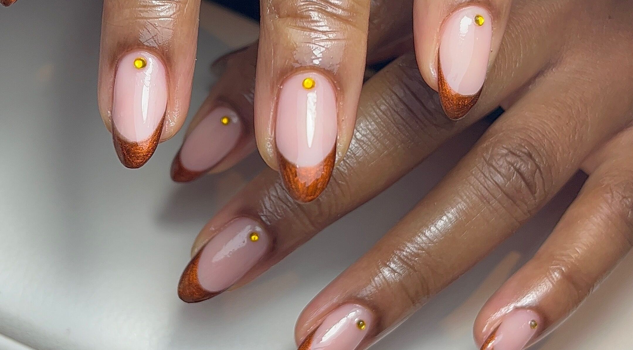 Stunning bronze-tipped nails at Green with Envy Nails, Sutton, South London, England, GB.