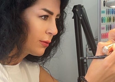 A skilled nail artist at SaHaR(Castle hill) in Castle Hill, New South Wales, AU creating detailed nail designs.