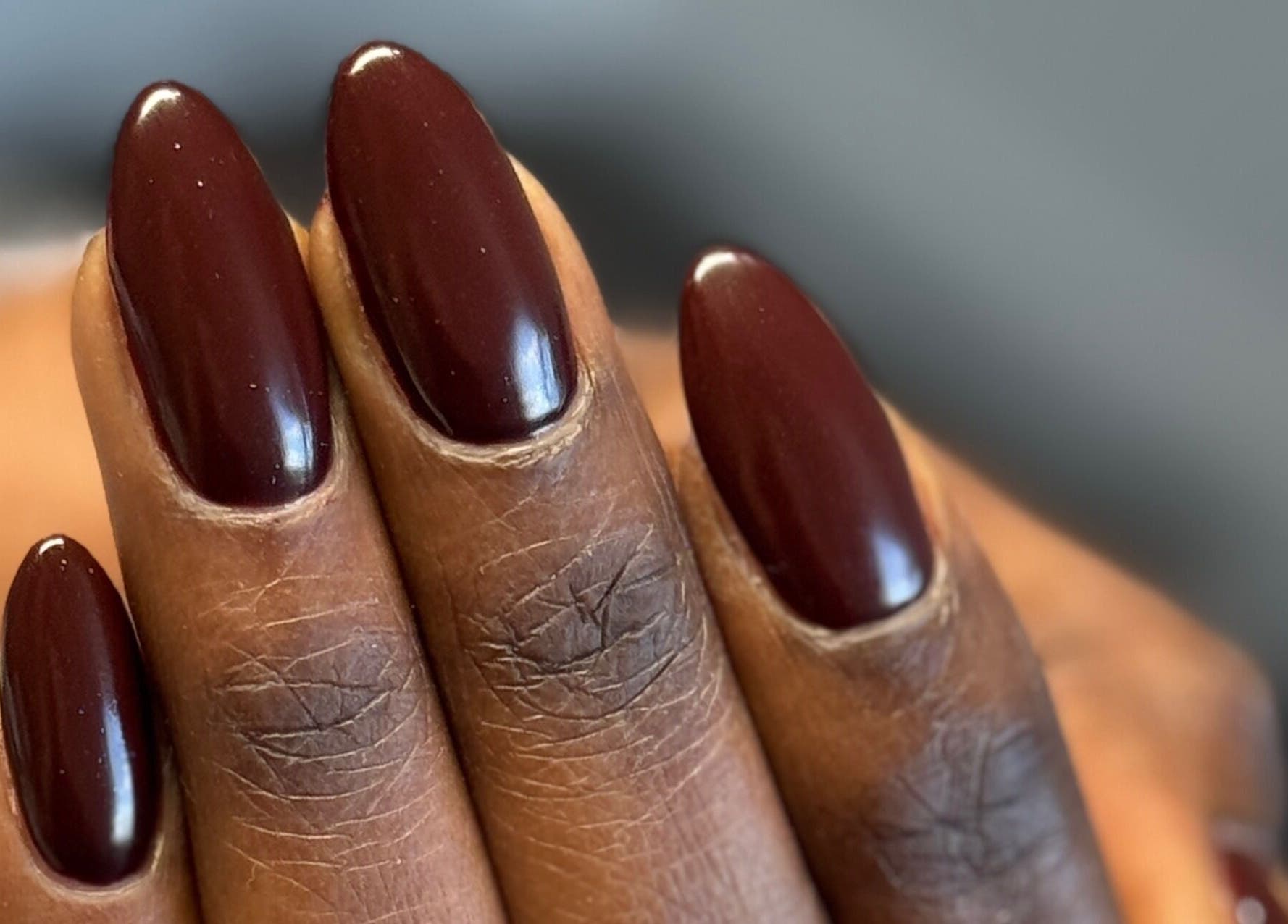 Close-up of elegant, mahogany-colored nails at SaHaR(Pyrmont) in Ultimo, New South Wales, AU.