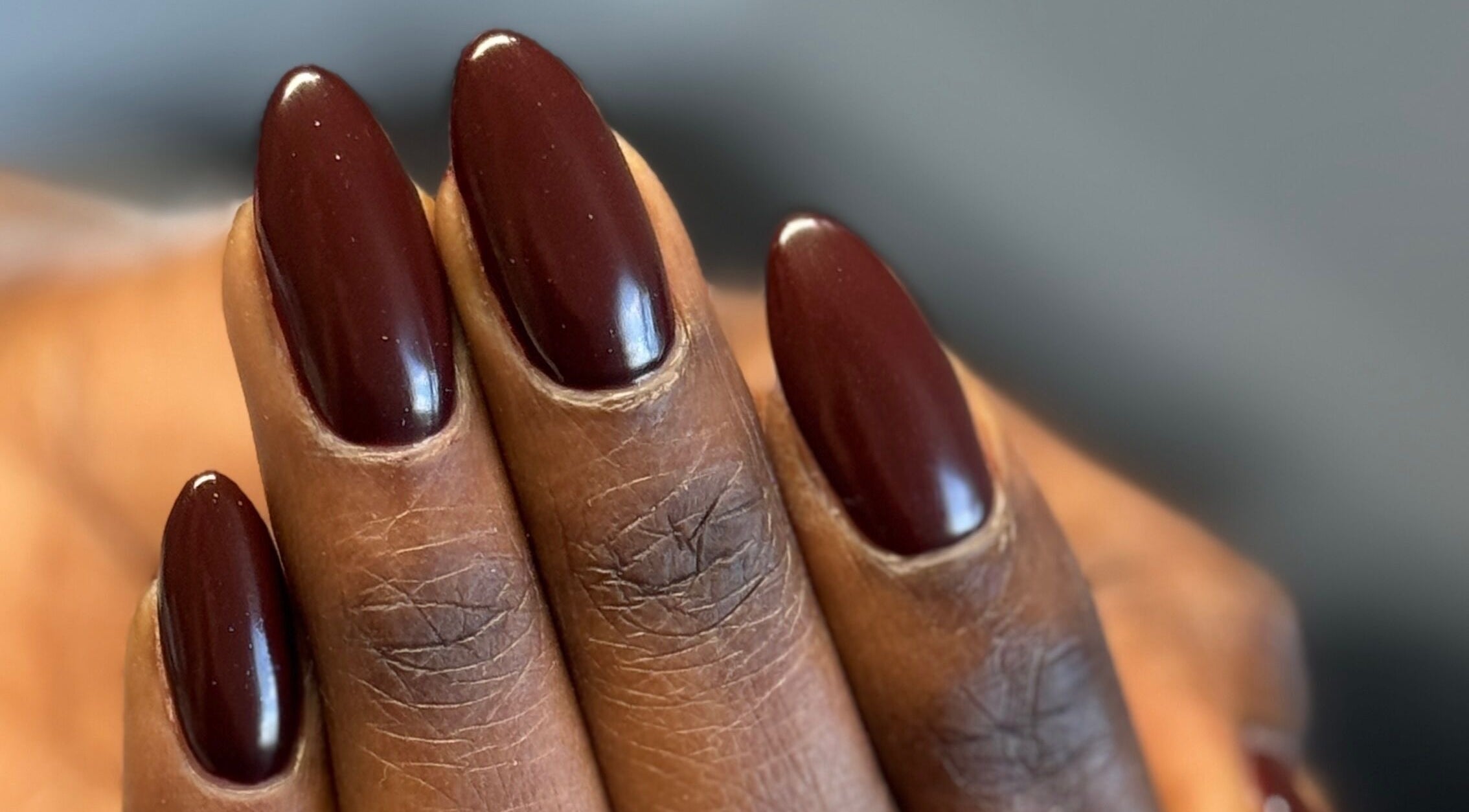 Close-up of elegant, mahogany-colored nails at SaHaR(Pyrmont) in Ultimo, New South Wales, AU.